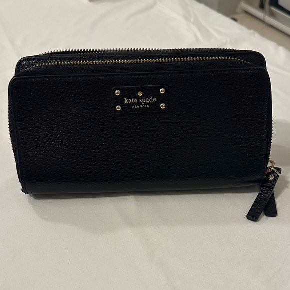 kate spade Handbags - kate spade black leather zip-around wallet with wrist strap